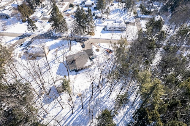 snowy aerial view with a residential view