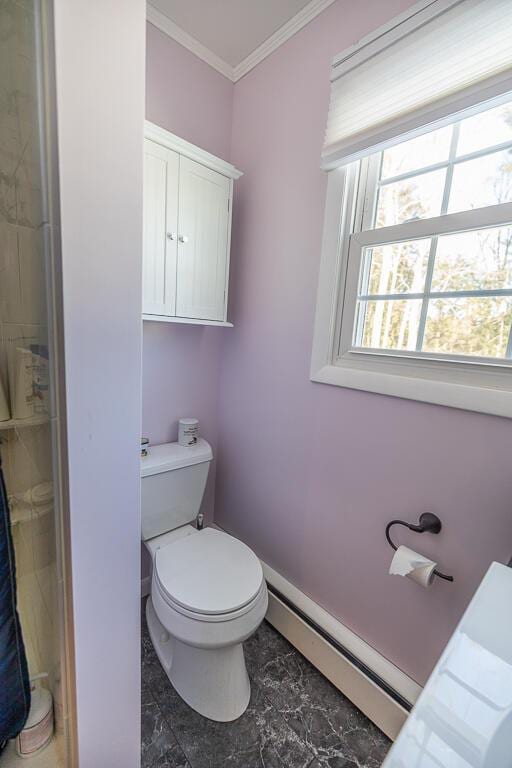 bathroom featuring baseboards, toilet, marble finish floor, baseboard heating, and crown molding