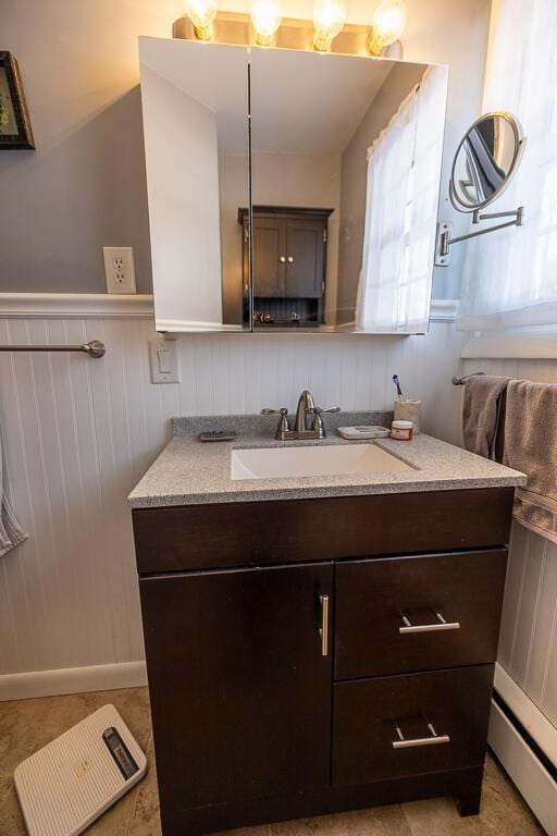 bathroom featuring wainscoting and vanity