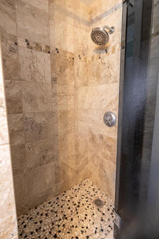 full bathroom with a shower stall