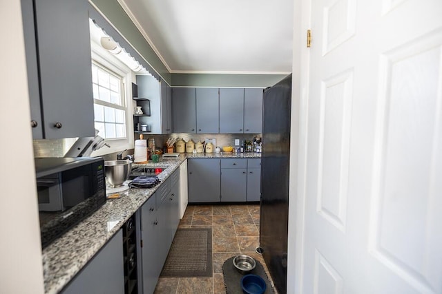 kitchen with open shelves, gray cabinets, black appliances, tasteful backsplash, and stone finish floor