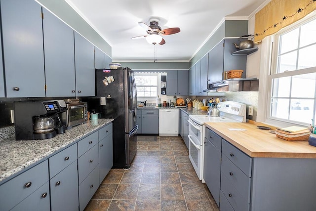 kitchen featuring white appliances, ornamental molding, extractor fan, open shelves, and a sink