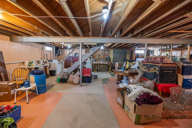 basement featuring washer / dryer, stairway, and a wealth of natural light