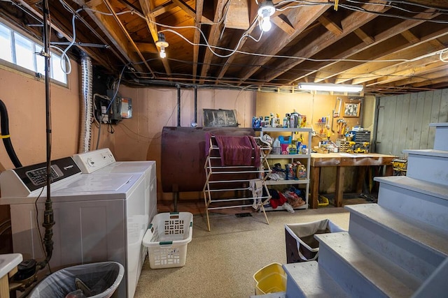 basement featuring separate washer and dryer and a workshop area