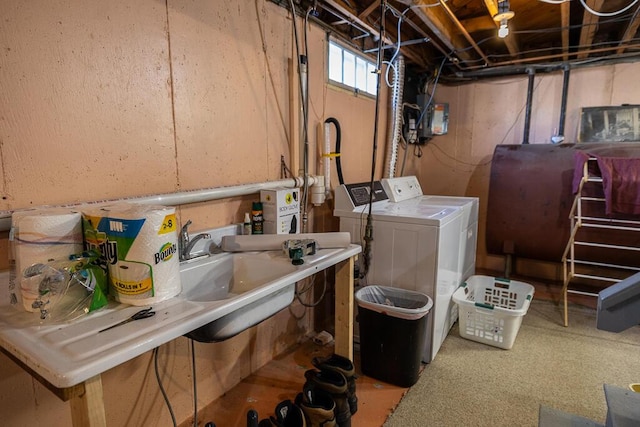 basement featuring washing machine and clothes dryer and heating fuel