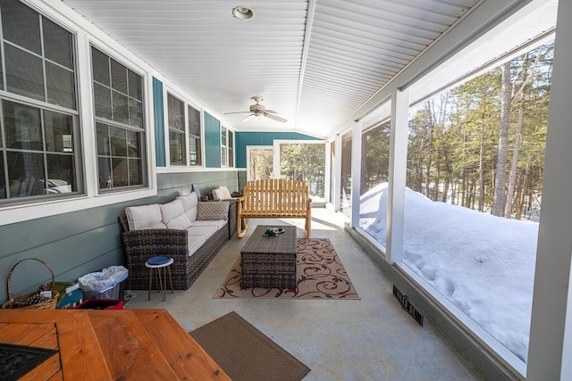 sunroom / solarium with ceiling fan and vaulted ceiling