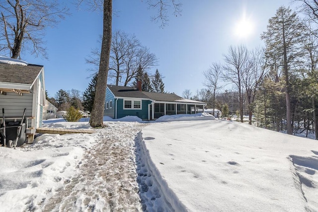 view of front of house with a sunroom