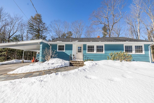 single story home with an attached carport