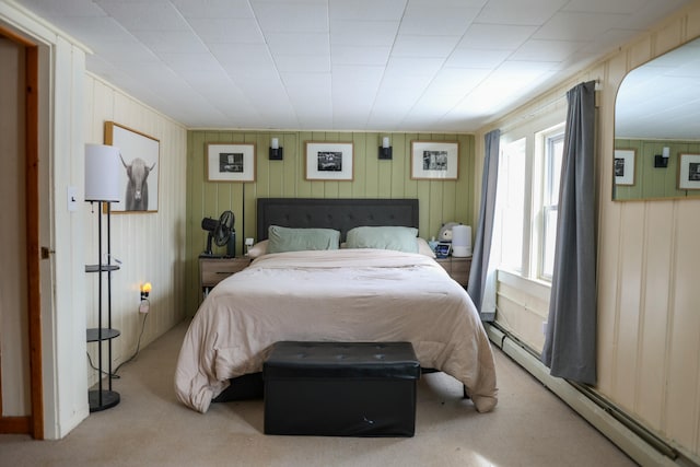 carpeted bedroom with a baseboard radiator