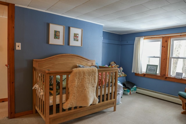 bedroom featuring carpet and baseboard heating