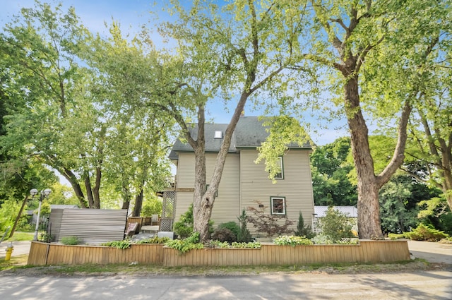 view of side of property with fence