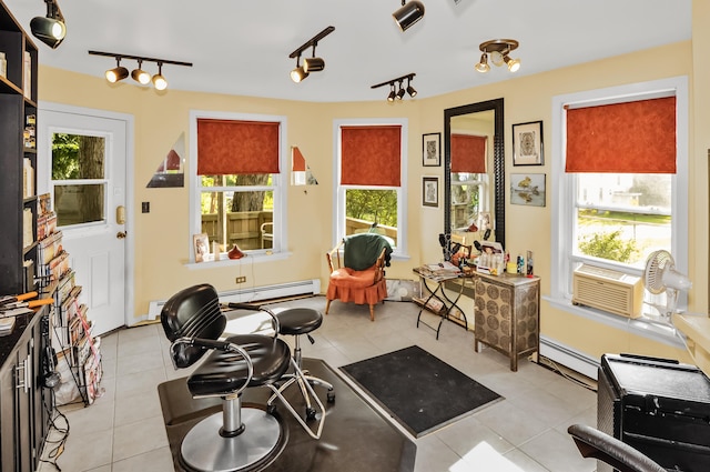 living area featuring light tile patterned floors, visible vents, a baseboard radiator, baseboard heating, and cooling unit