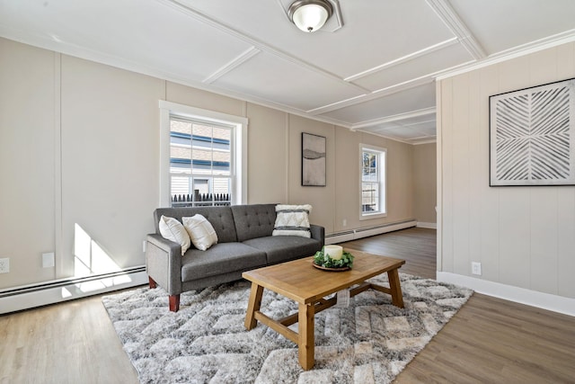 living room with a wealth of natural light, baseboard heating, and wood finished floors