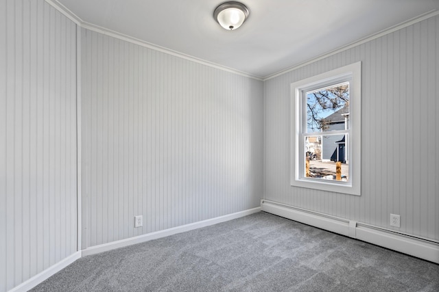 carpeted empty room with baseboards, baseboard heating, and ornamental molding