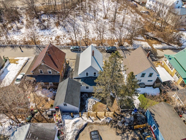 snowy aerial view with a residential view