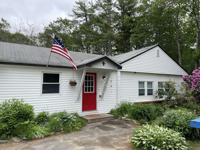 view of front of house featuring roof with shingles