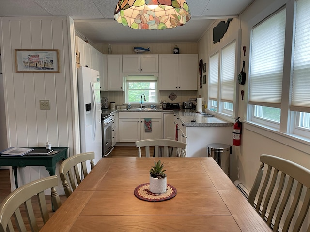 dining space featuring baseboard heating