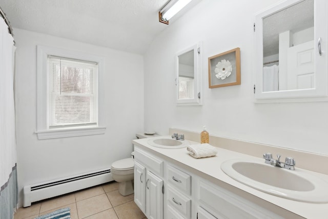 full bathroom featuring tile patterned flooring, toilet, a sink, and baseboard heating