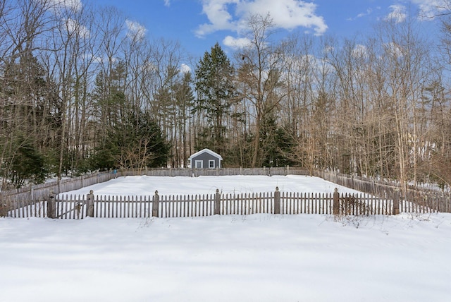 yard covered in snow featuring a fenced front yard