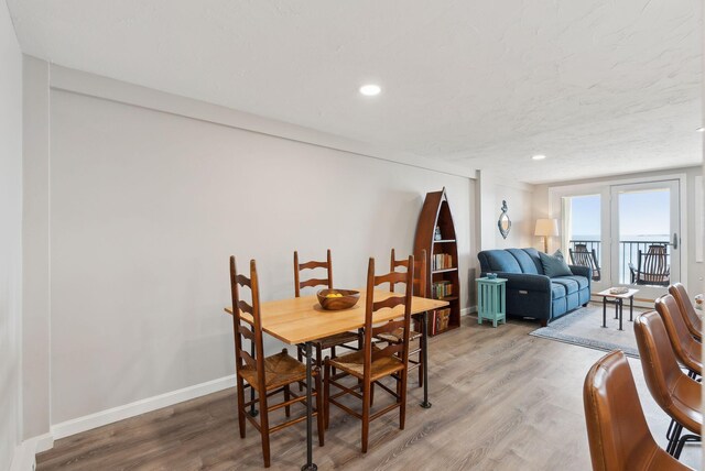 191 E Grand Ave Unit 606, Old Orchard Beach, ME 04064 - dining space with light wood-type flooring, baseboards, and recessed lighting