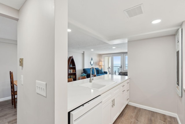 191 E Grand Ave Unit 606, Old Orchard Beach, ME 04064 - kitchen featuring dishwasher, light wood-type flooring, recessed lighting, a sink, and light countertops