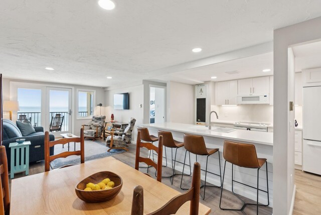 191 E Grand Ave Unit 606, Old Orchard Beach, ME 04064 - dining space featuring light wood finished floors and recessed lighting