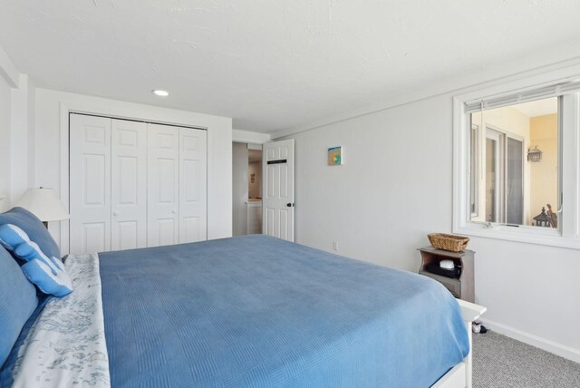 191 E Grand Ave Unit 606, Old Orchard Beach, ME 04064 - bedroom with carpet, baseboards, a closet, and recessed lighting