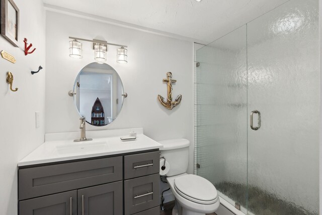 191 E Grand Ave Unit 606, Old Orchard Beach, ME 04064 - bathroom featuring vanity, a shower stall, and toilet