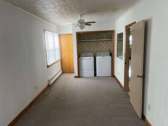 laundry area with a baseboard radiator, baseboards, washer and clothes dryer, and carpet flooring