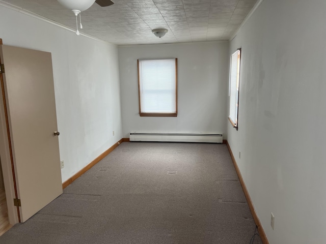 carpeted empty room featuring a baseboard radiator, baseboards, ceiling fan, and ornamental molding