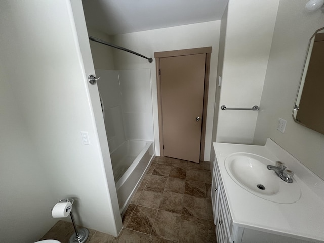 bathroom featuring shower / washtub combination and vanity