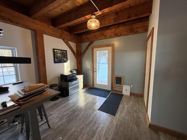 entrance foyer featuring a healthy amount of sunlight, wood ceiling, beam ceiling, and wood finished floors