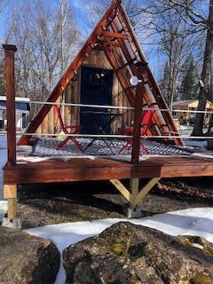 view of playground with a wooden deck