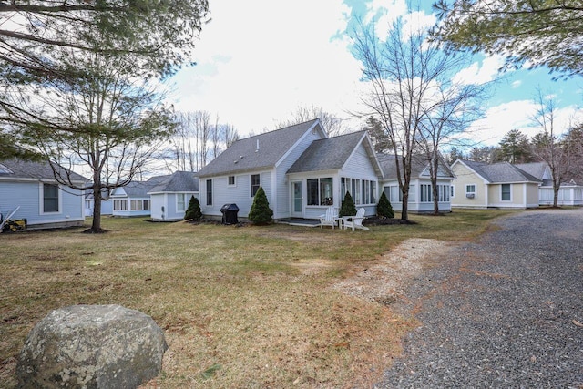 454 Post Rd Unit 128, Wells, ME 04090 - view of front of home with gravel driveway and a front yard