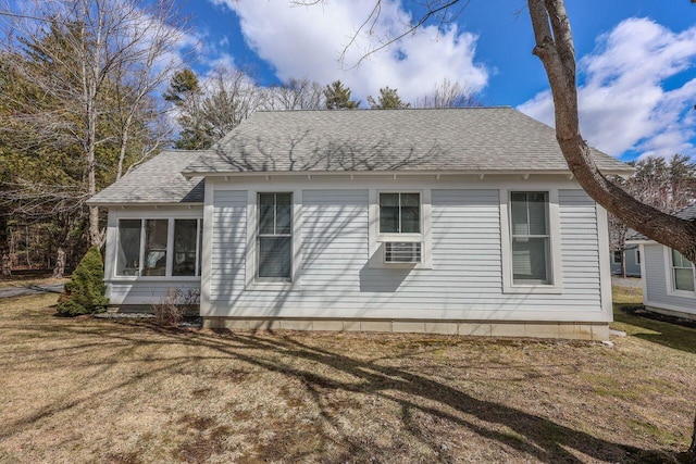454 Post Rd Unit 128, Wells, ME 04090 - view of home's exterior featuring a lawn and a shingled roof