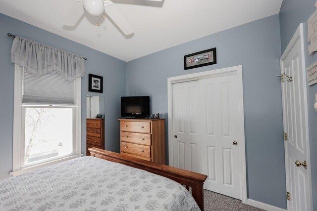 454 Post Rd Unit 128, Wells, ME 04090 - carpeted bedroom with baseboards, a ceiling fan, and a closet