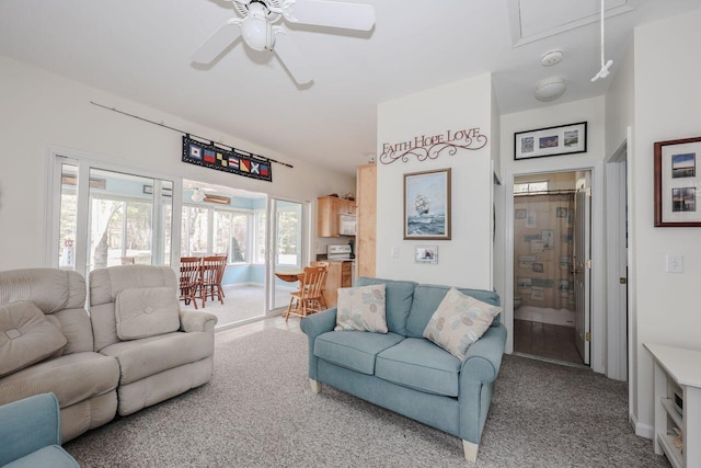 454 Post Rd Unit 128, Wells, ME 04090 - carpeted living room with attic access and ceiling fan