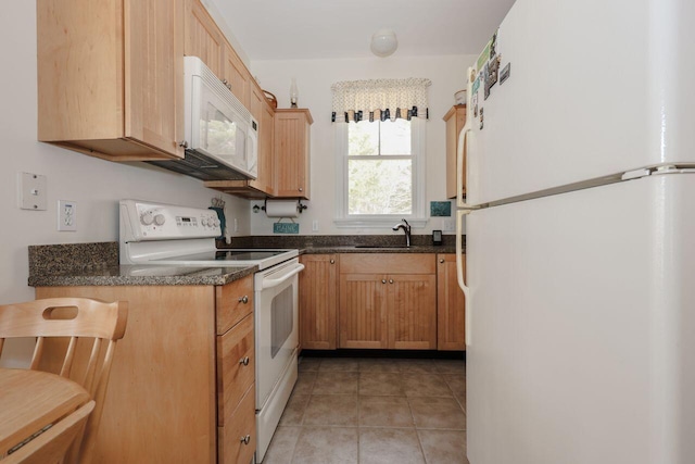 454 Post Rd Unit 128, Wells, ME 04090 - kitchen featuring white appliances, a sink, and light tile patterned flooring