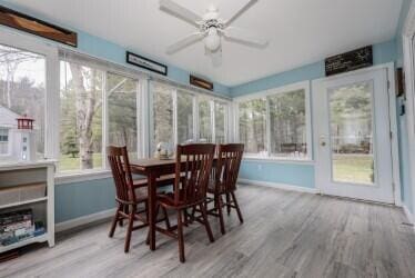454 Post Rd Unit 128, Wells, ME 04090 - sunroom / solarium featuring baseboards and wood finished floors