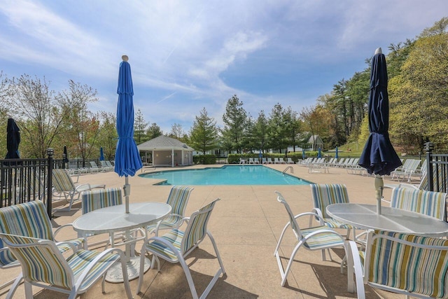 454 Post Rd Unit 128, Wells, ME 04090 - community pool featuring outdoor dining area, a patio, and fence
