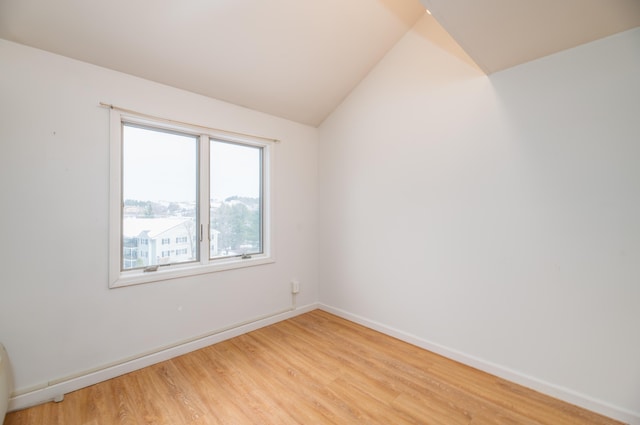 34 Parkwood Dr Unit 203, Augusta, ME 04330 - spare room with light wood-type flooring, baseboards, and lofted ceiling