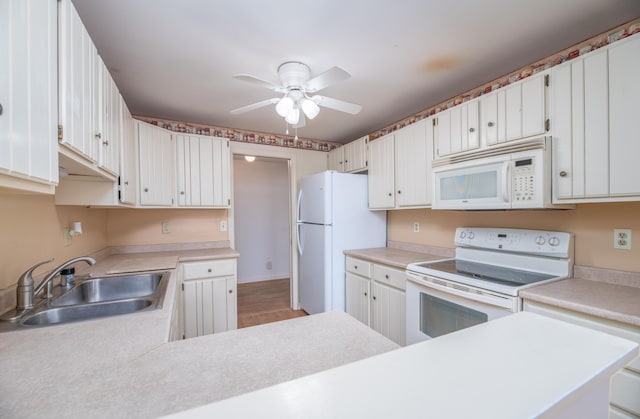 34 Parkwood Dr Unit 203, Augusta, ME 04330 - kitchen featuring white appliances, a sink, a ceiling fan, and light countertops