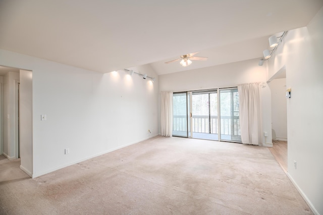 34 Parkwood Dr Unit 203, Augusta, ME 04330 - empty room featuring light carpet, ceiling fan, vaulted ceiling, and baseboards