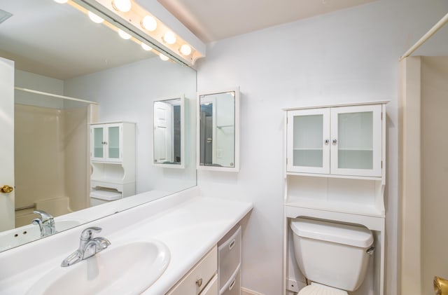 34 Parkwood Dr Unit 203, Augusta, ME 04330 - bathroom with toilet, vanity, and baseboards