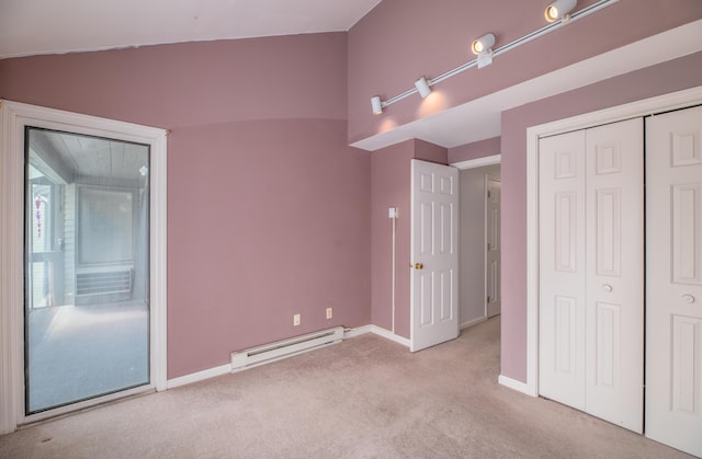 34 Parkwood Dr Unit 203, Augusta, ME 04330 - unfurnished bedroom featuring baseboard heating, carpet, baseboards, and a closet