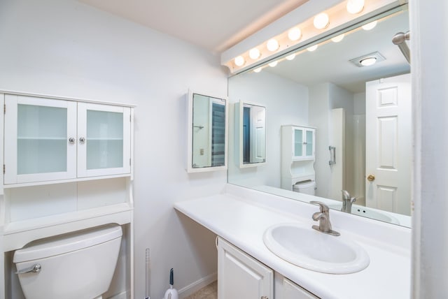 34 Parkwood Dr Unit 203, Augusta, ME 04330 - bathroom featuring toilet, vanity, and baseboards