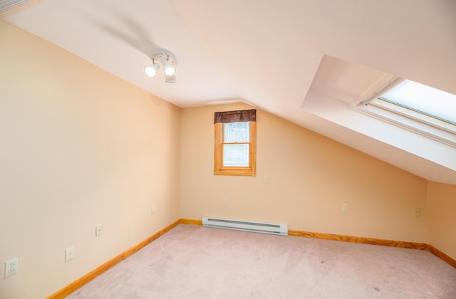 34 Parkwood Dr Unit 203, Augusta, ME 04330 - additional living space featuring a baseboard heating unit, vaulted ceiling, carpet, and baseboards