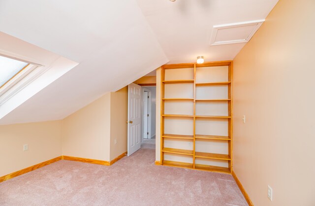 34 Parkwood Dr Unit 203, Augusta, ME 04330 - additional living space with carpet flooring, vaulted ceiling, baseboards, and attic access