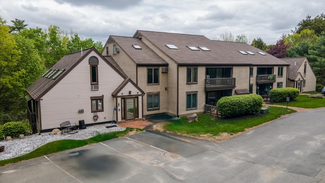 34 Parkwood Dr Unit 203, Augusta, ME 04330 - view of front of home with a shingled roof and uncovered parking