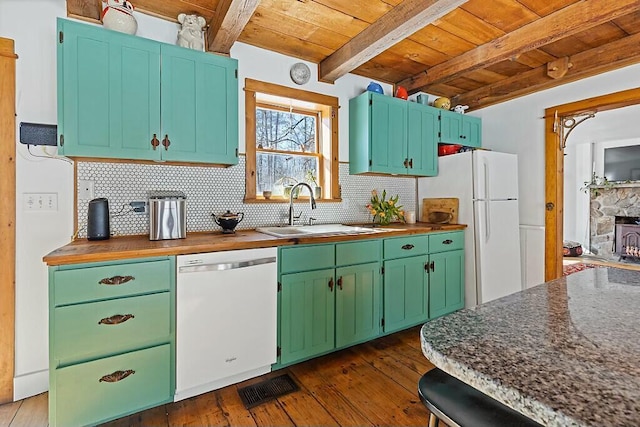 kitchen featuring white appliances, wooden ceiling, a sink, and decorative backsplash